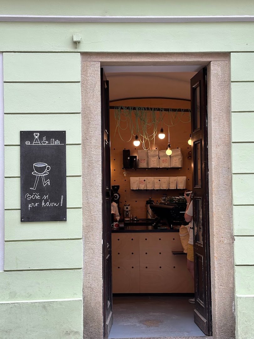 Storefront of onesip coffee, specialty coffee shop in Prague