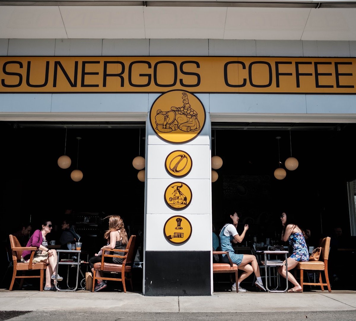 Storefront of Sunergos Coffee, specialty coffee shop in Louisville
