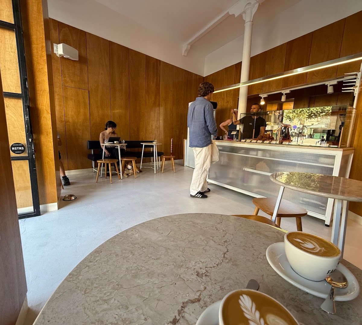 Interior of FÁBRICA COFFEE ROASTERS - SANTOS, specialty coffee shop in Lisbon