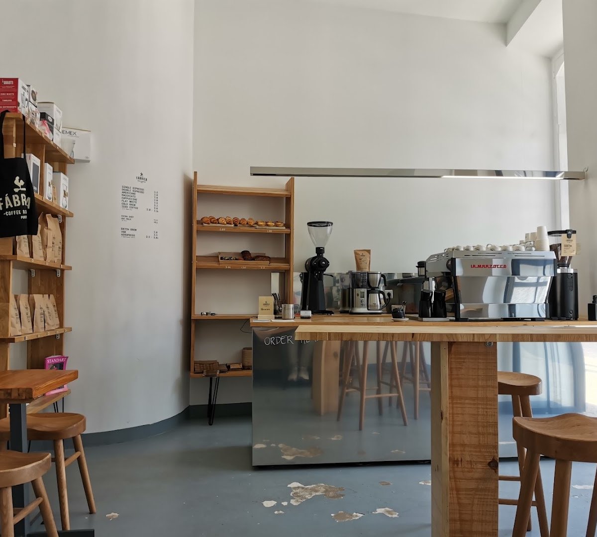 Interior of FÁBRICA COFFEE ROASTERS - SANTOS, specialty coffee shop in Lisbon