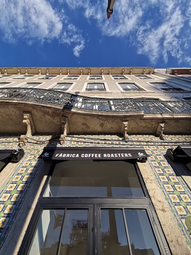 Storefront of FÁBRICA COFFEE ROASTERS - SANTOS, specialty coffee shop in Lisbon