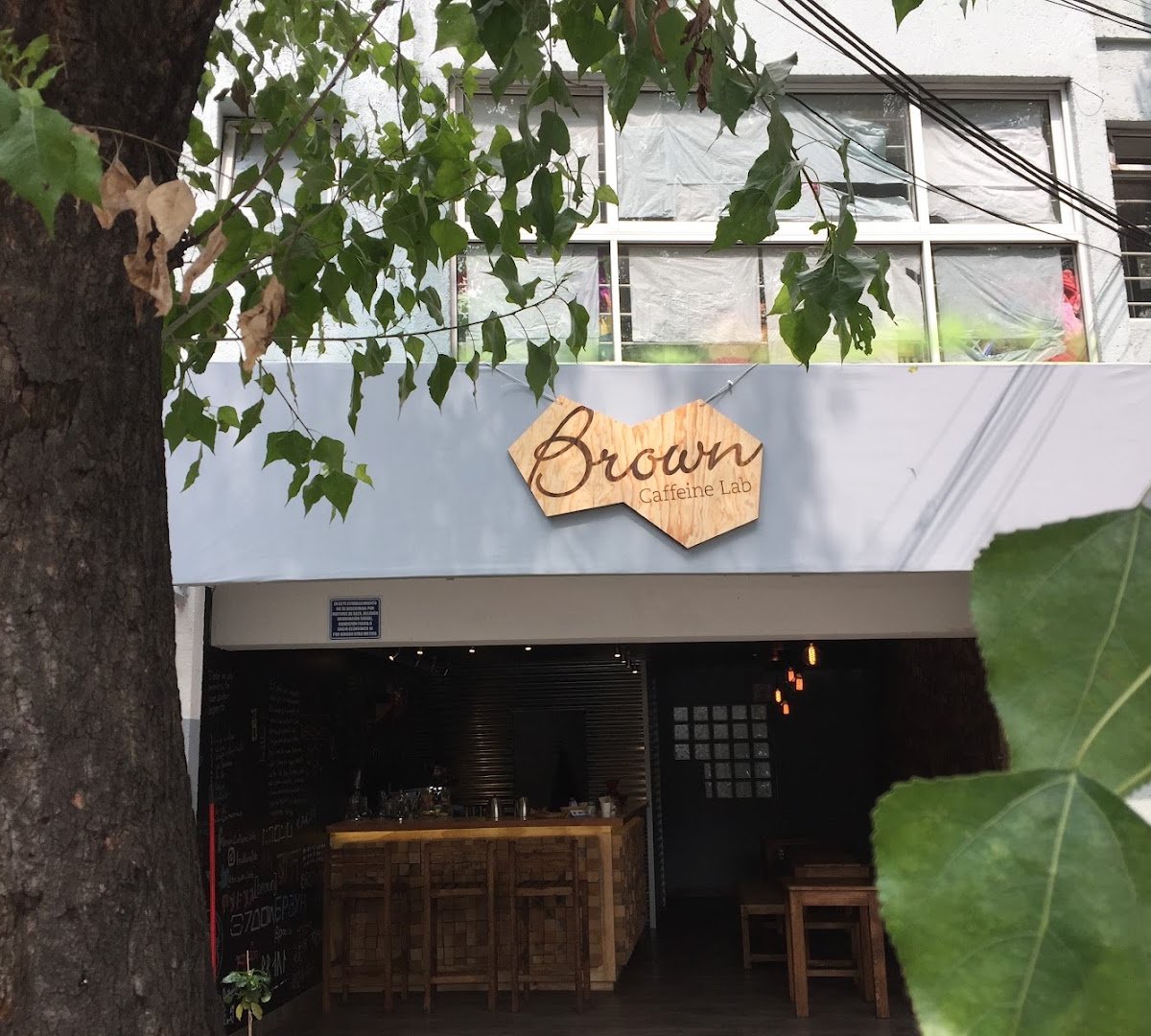 Storefront of Brown Caffeine Lab, specialty coffee shop in Mexico City