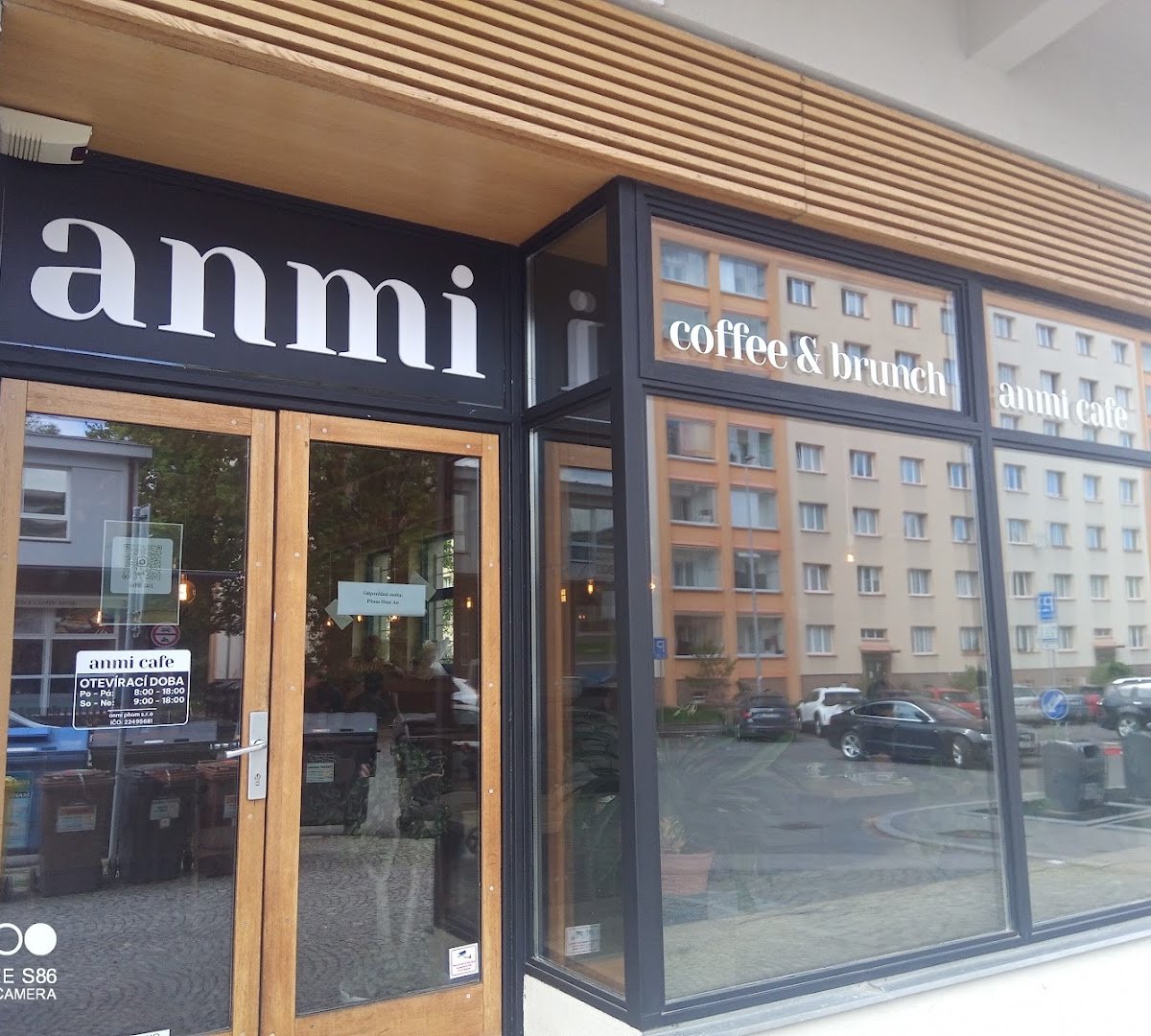Storefront of anmi cafe, specialty coffee shop in Prague