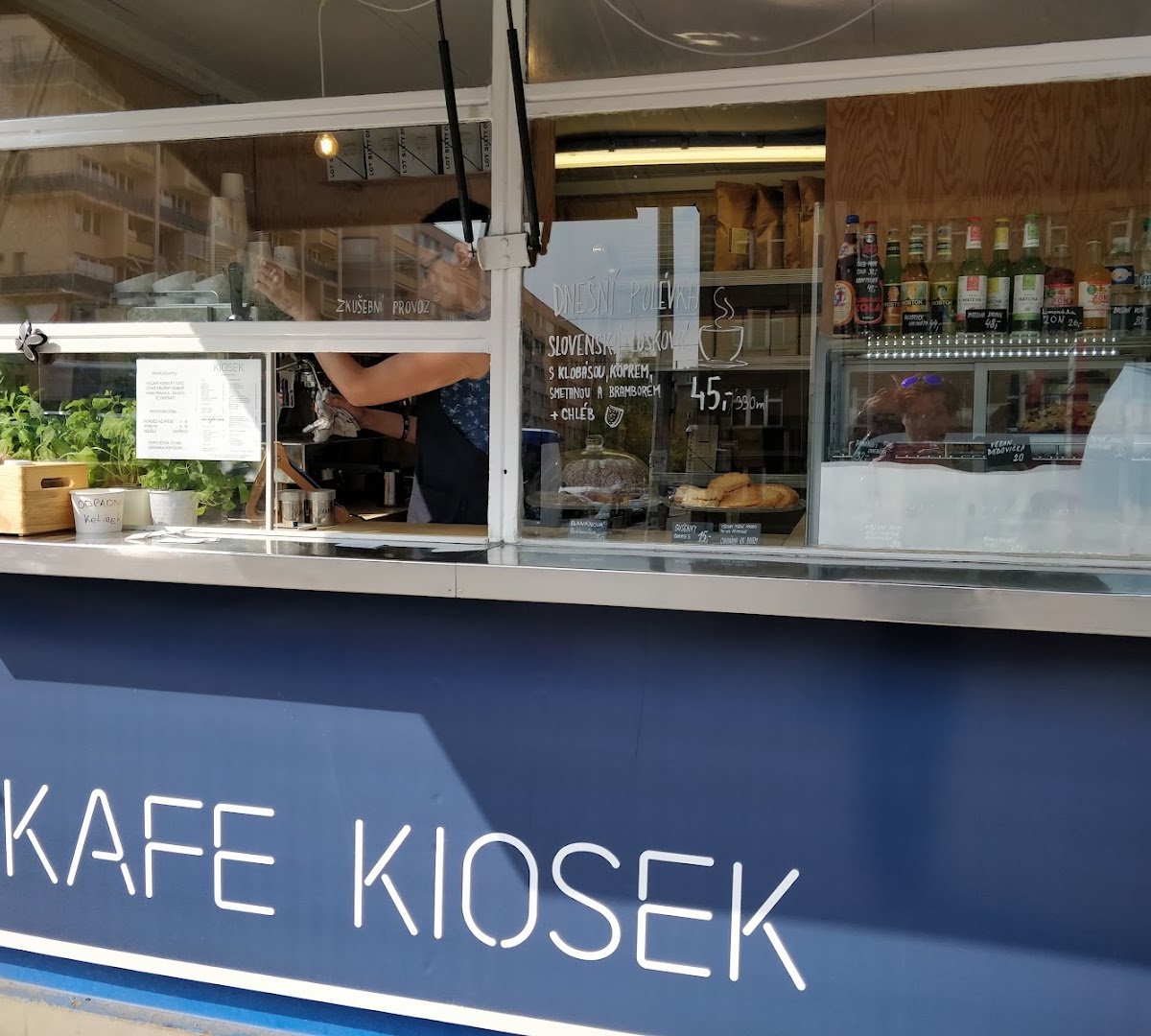 Storefront of Kiosek Dejvice, specialty coffee shop in Prague