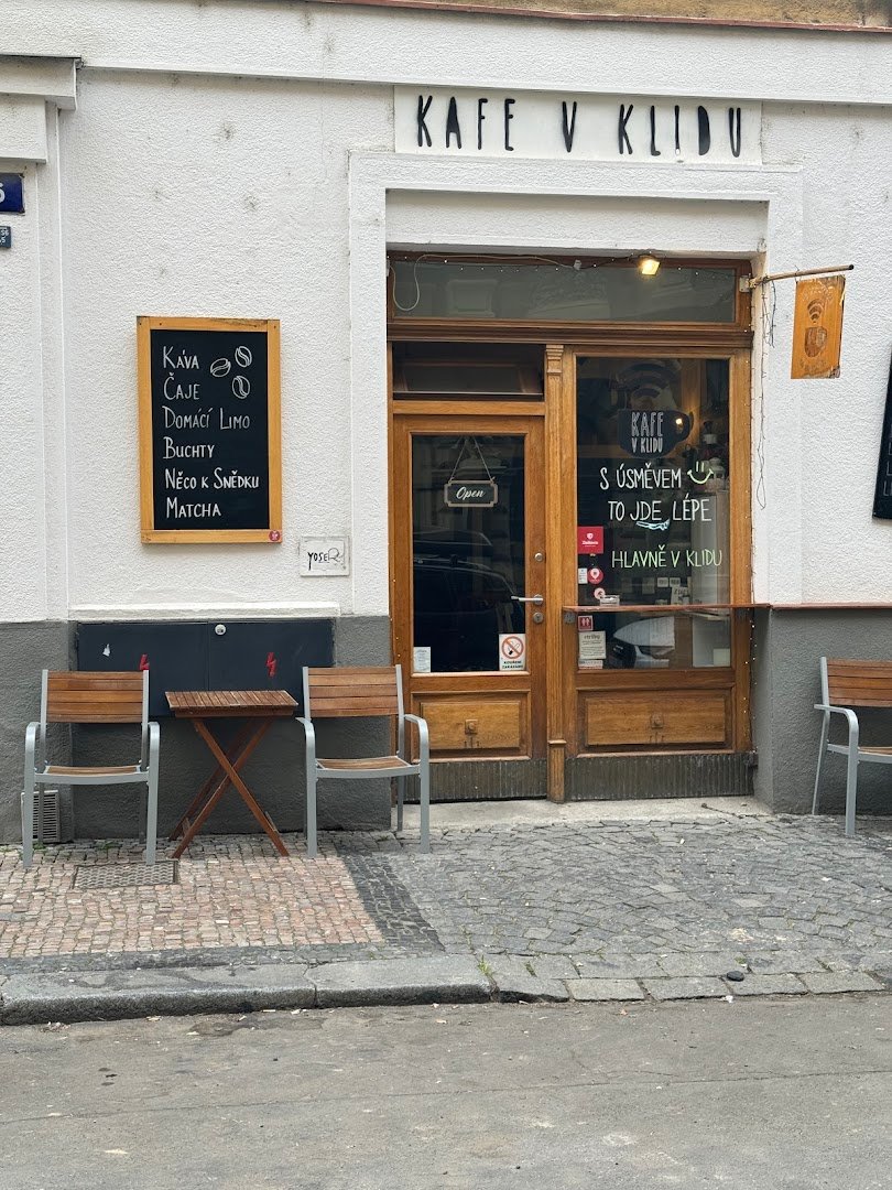 Storefront of Kafe v Klidu, specialty coffee shop in Prague
