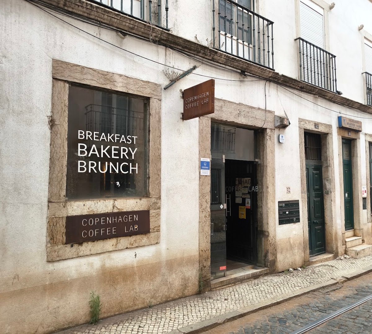 Storefront of Copenhagen Coffee Lab Alfama, specialty coffee shop in Lisbon
