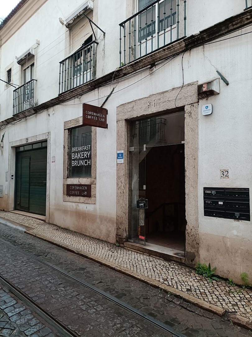 Storefront of Copenhagen Coffee Lab Alfama, specialty coffee shop in Lisbon