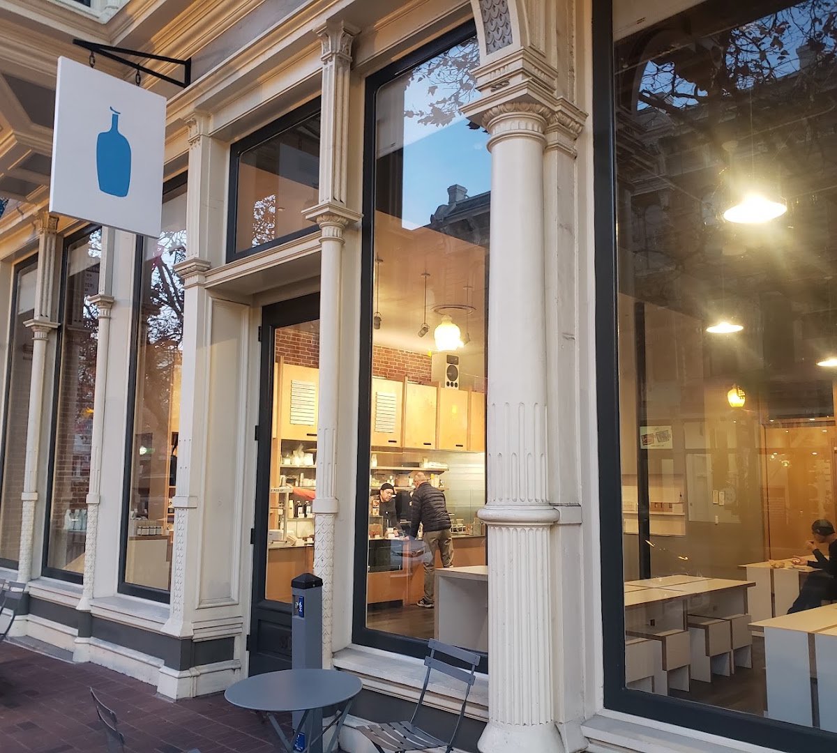 Storefront of Blue Bottle Coffee, specialty coffee shop in Oakland
