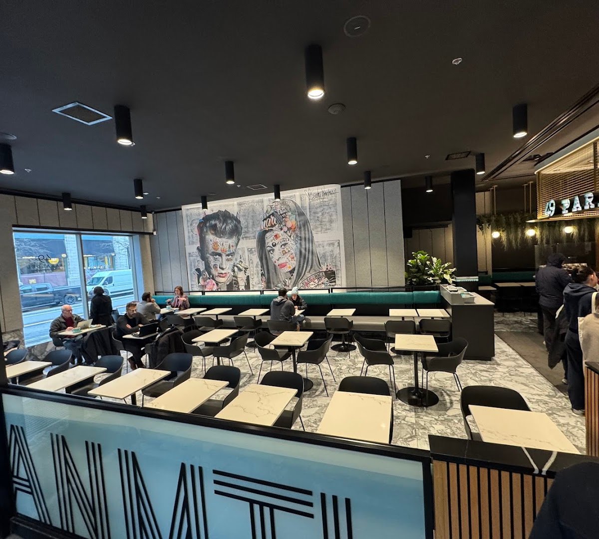 Interior of 49th Parallel Café & Lucky’s Doughnuts - McGill, specialty coffee shop in Montreal