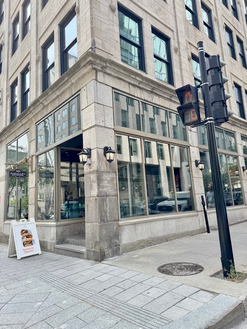 Storefront of 49th Parallel Café & Lucky’s Doughnuts - McGill, specialty coffee shop in Montreal
