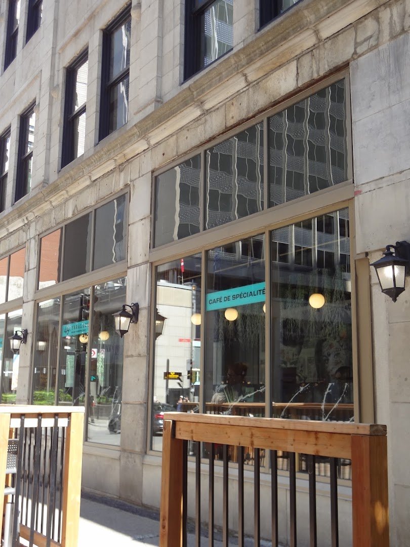 Storefront of 49th Parallel Café & Lucky’s Doughnuts - McGill, specialty coffee shop in Montreal