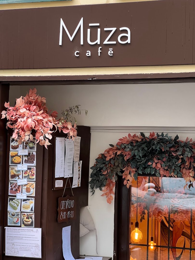Storefront of Múza Café, specialty coffee shop in Prague