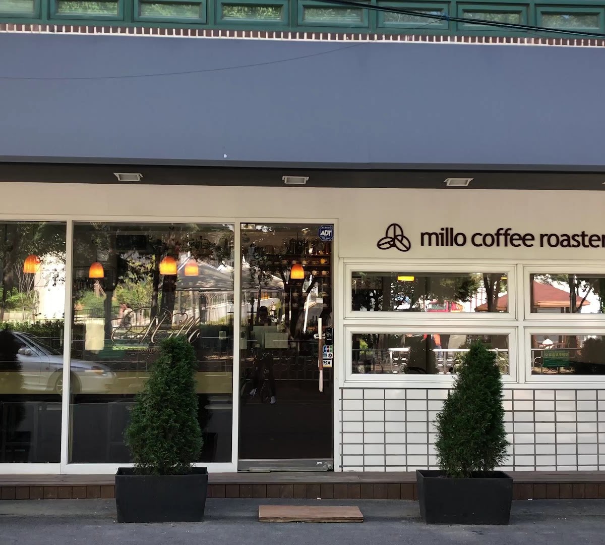 Storefront of Millo Coffee Roasters, specialty coffee shop in Seoul