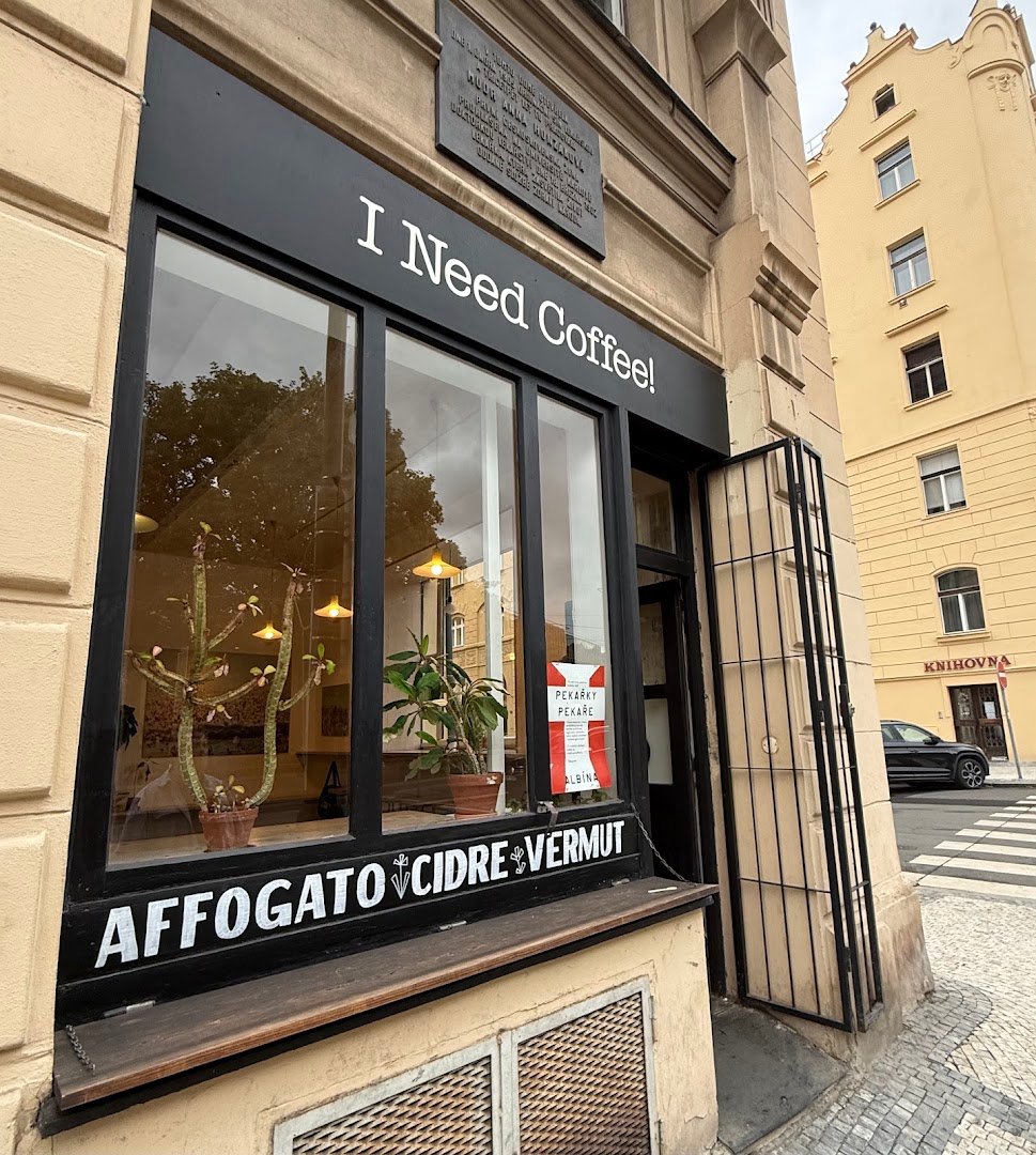Storefront of I Need Coffee!, specialty coffee shop in Prague