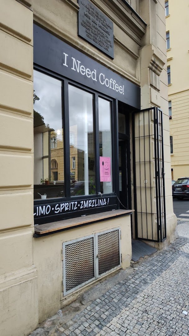 Storefront of I Need Coffee!, specialty coffee shop in Prague