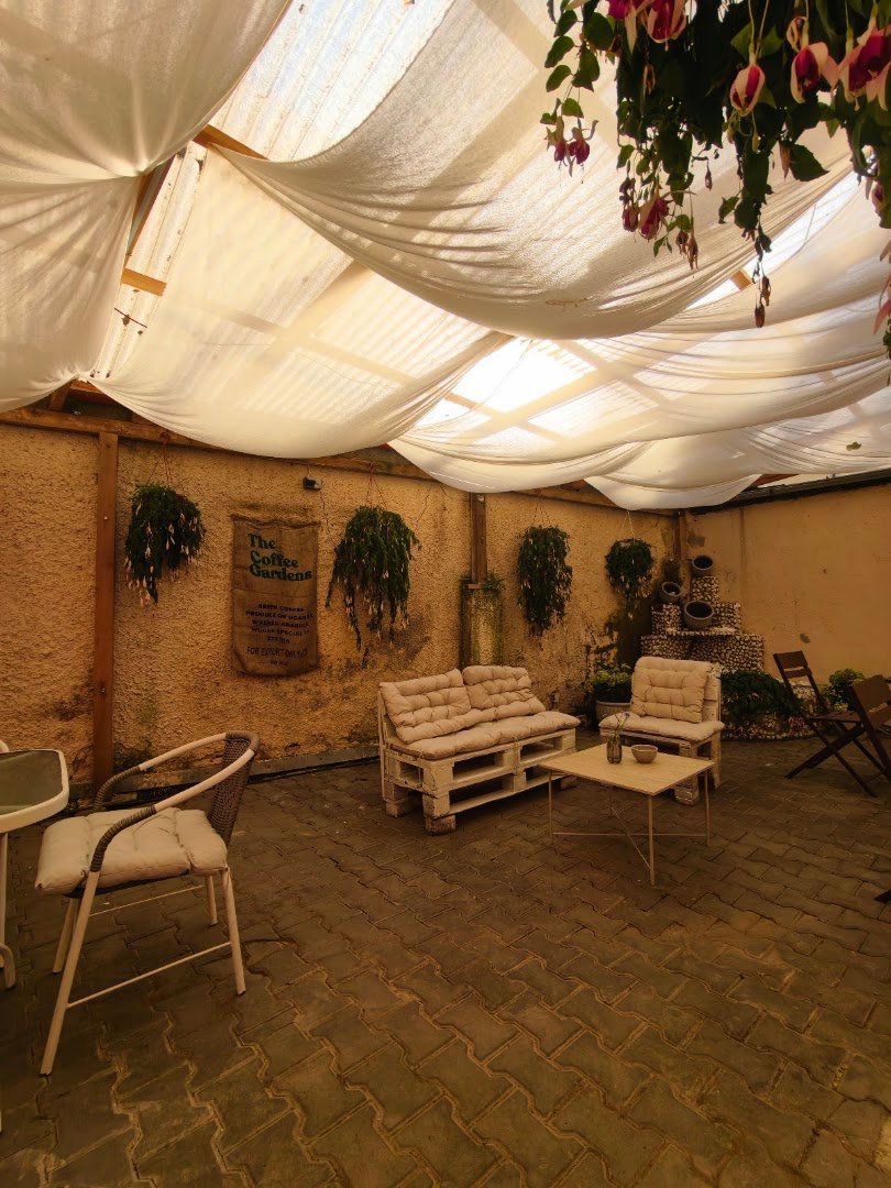 Storefront of ANWI cafe, specialty coffee shop in Prague