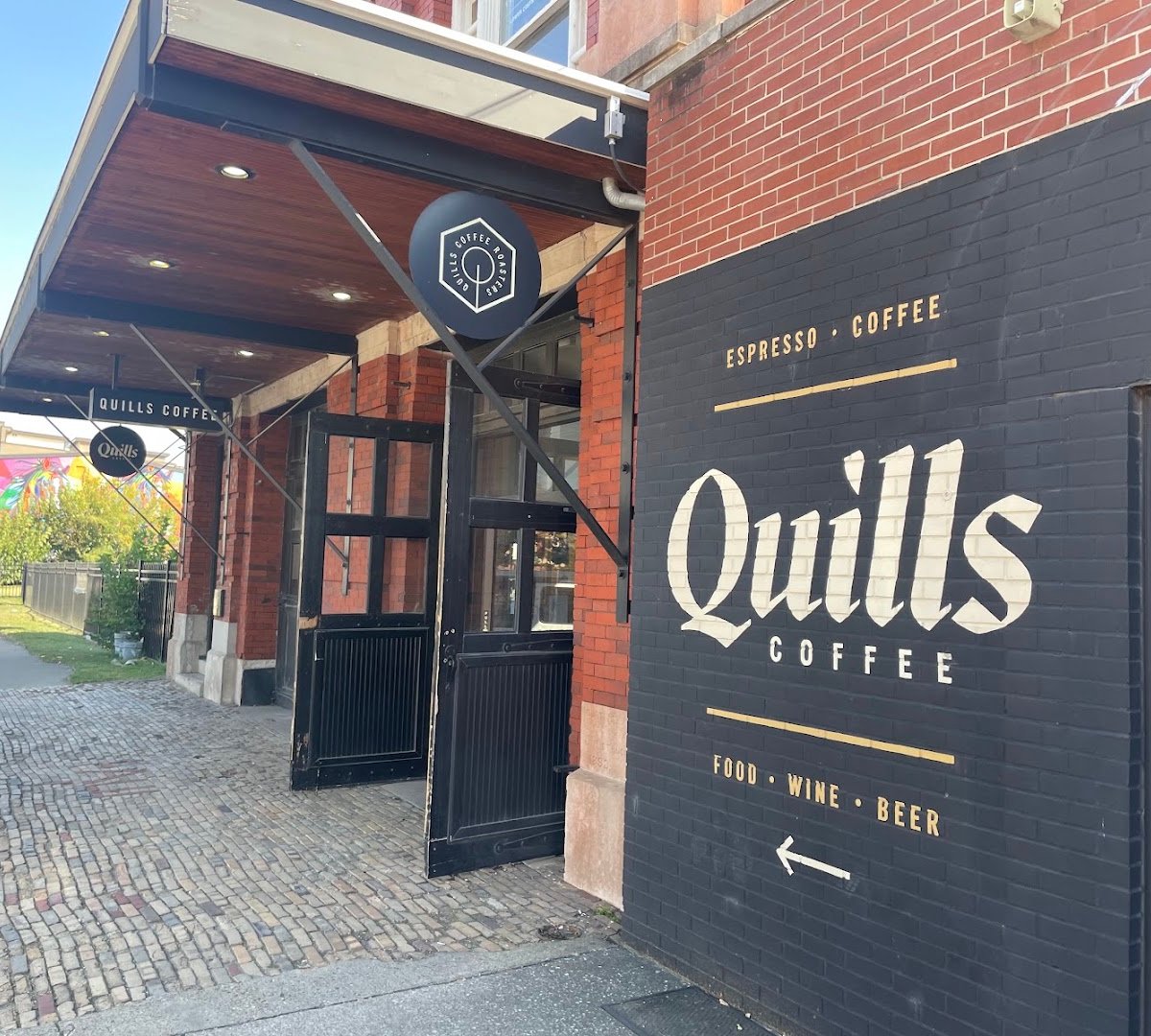 Storefront of Quills Coffee, specialty coffee shop in Louisville