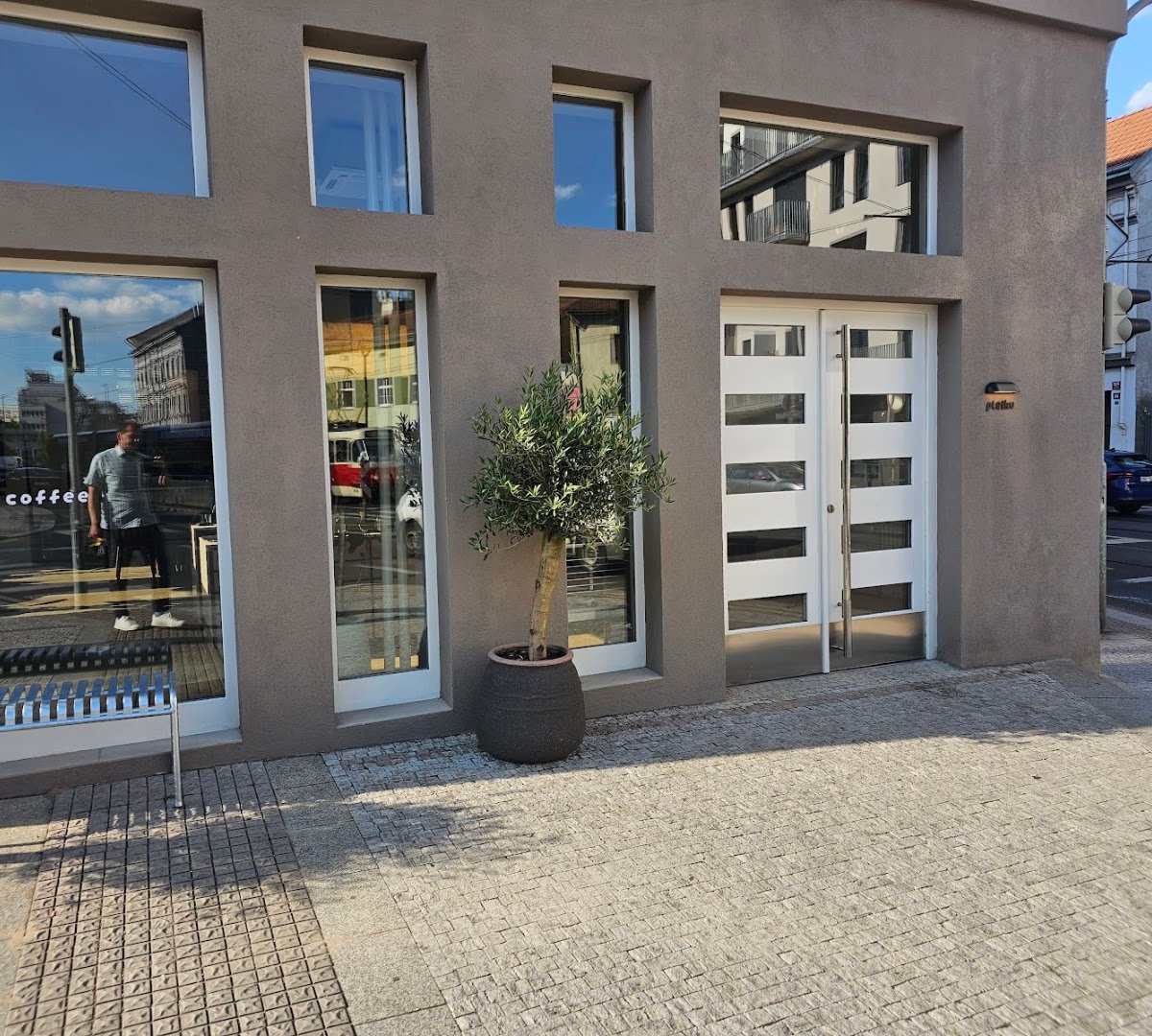 Storefront of Pleiku Coffee, specialty coffee shop in Prague