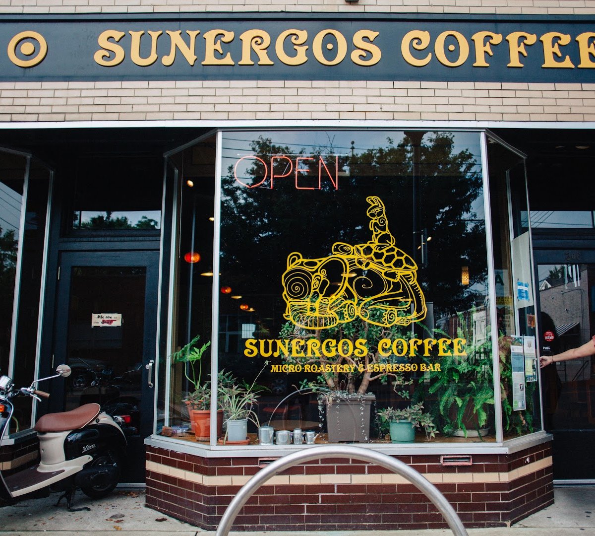 Storefront of Sunergos Coffee, specialty coffee shop in Louisville