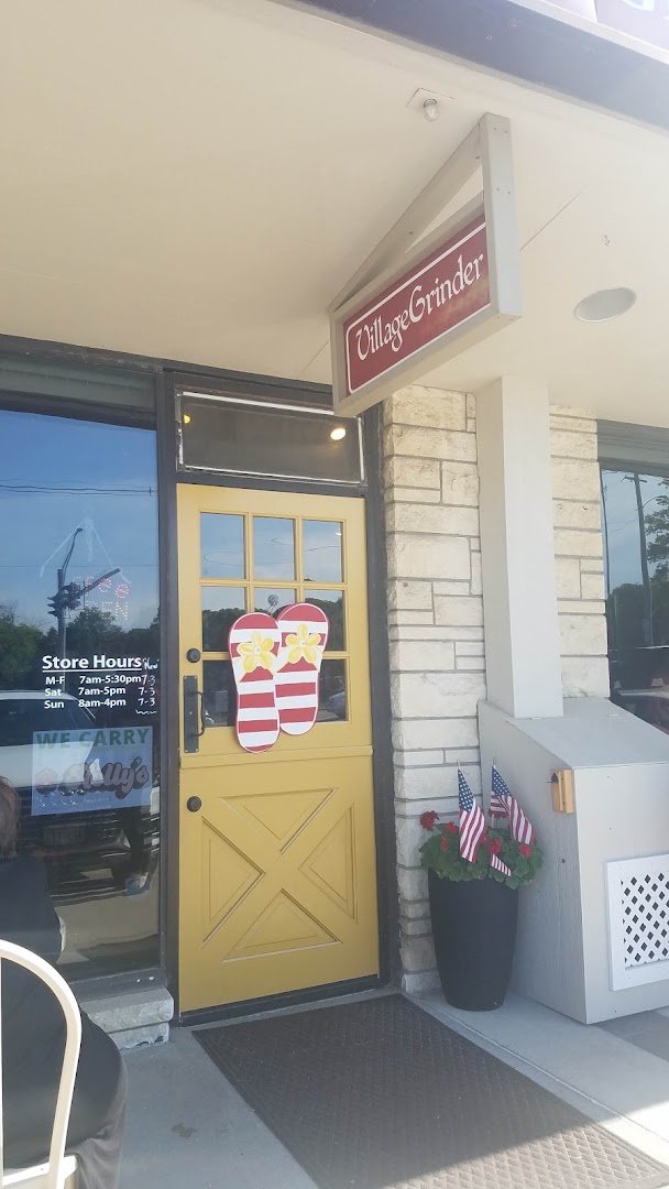Storefront of Village Grinder, specialty coffee shop in Omaha