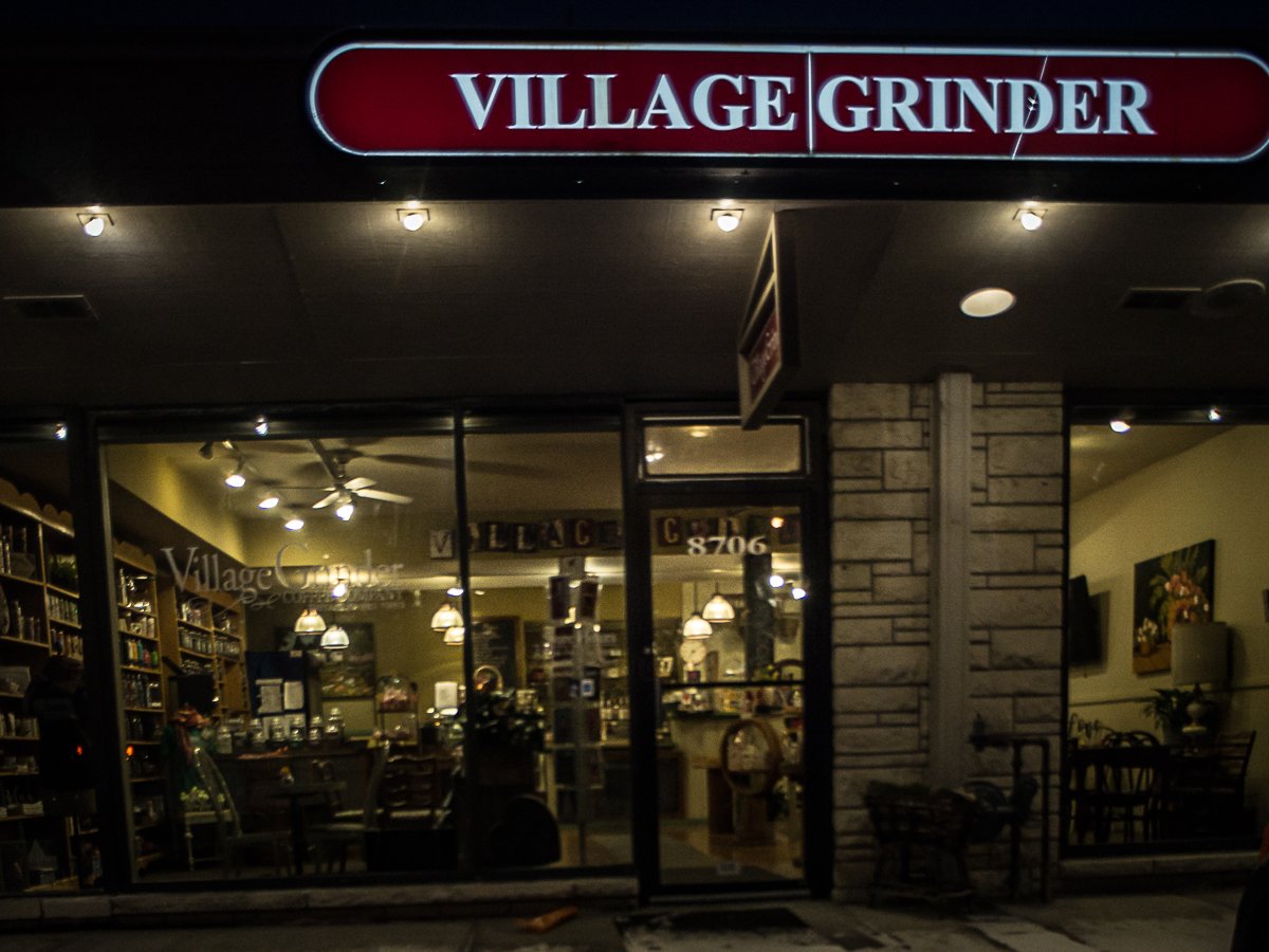 Storefront of Village Grinder, specialty coffee shop in Omaha