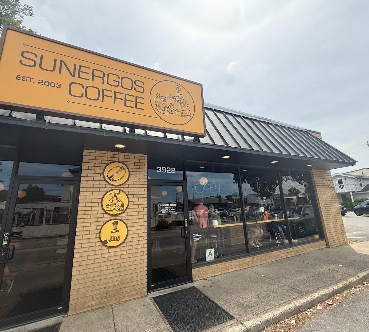Storefront of Sunergos Coffee, specialty coffee shop in Louisville