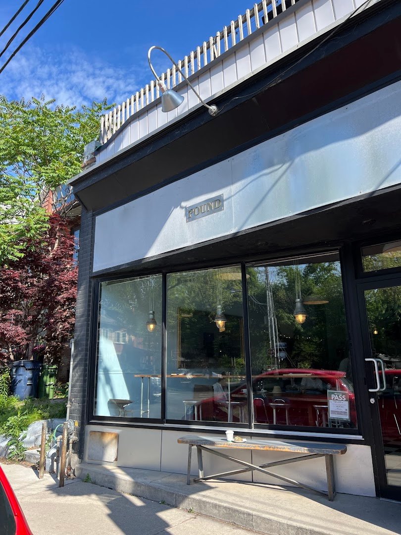 Storefront of Ezra's Pound, specialty coffee shop in Toronto