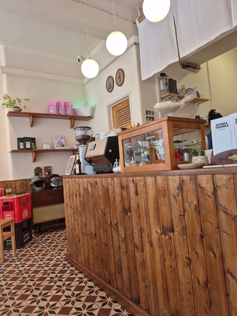 Interior of Double Trouble Specialty Coffee Campo de Ourique, specialty coffee shop in Lisbon