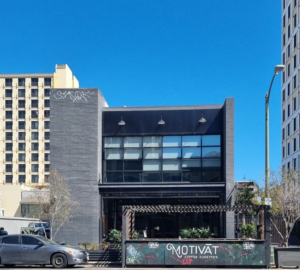 Storefront of Motivāt Coffee Roasters, specialty coffee shop in Oakland