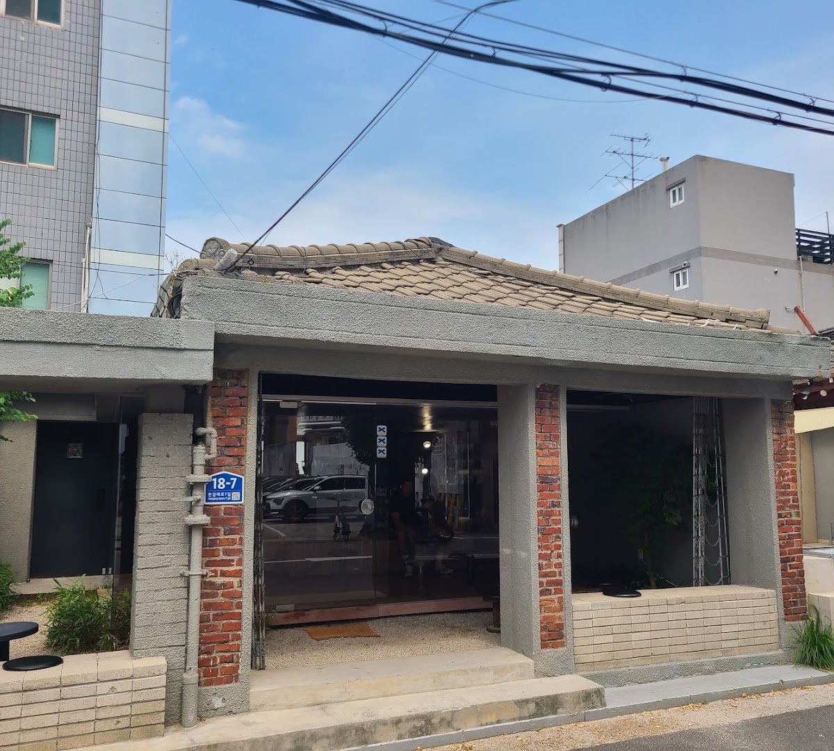 Storefront of Travertine Coffee, specialty coffee shop in Seoul