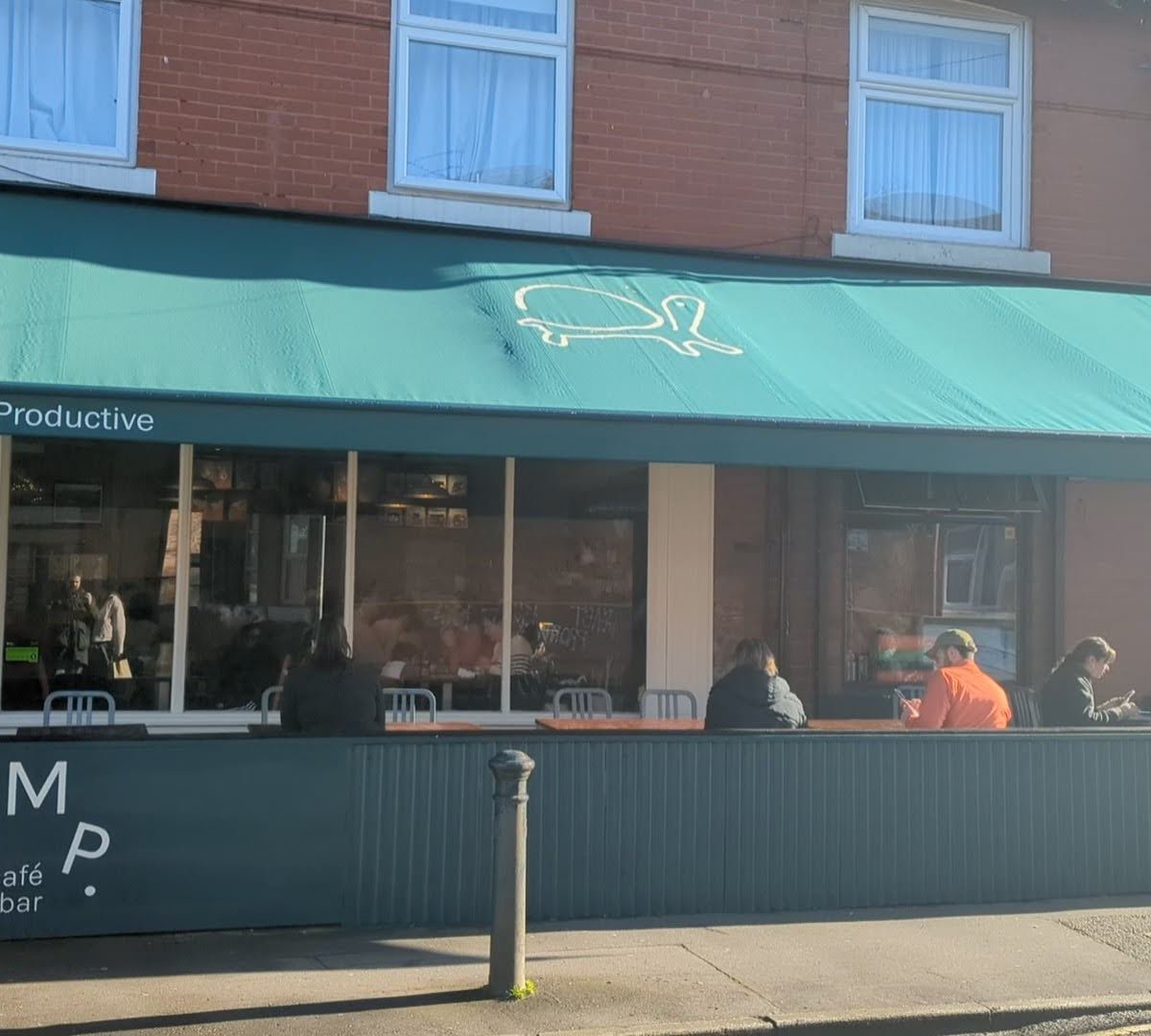 Storefront of Something More Productive, specialty coffee shop in Manchester