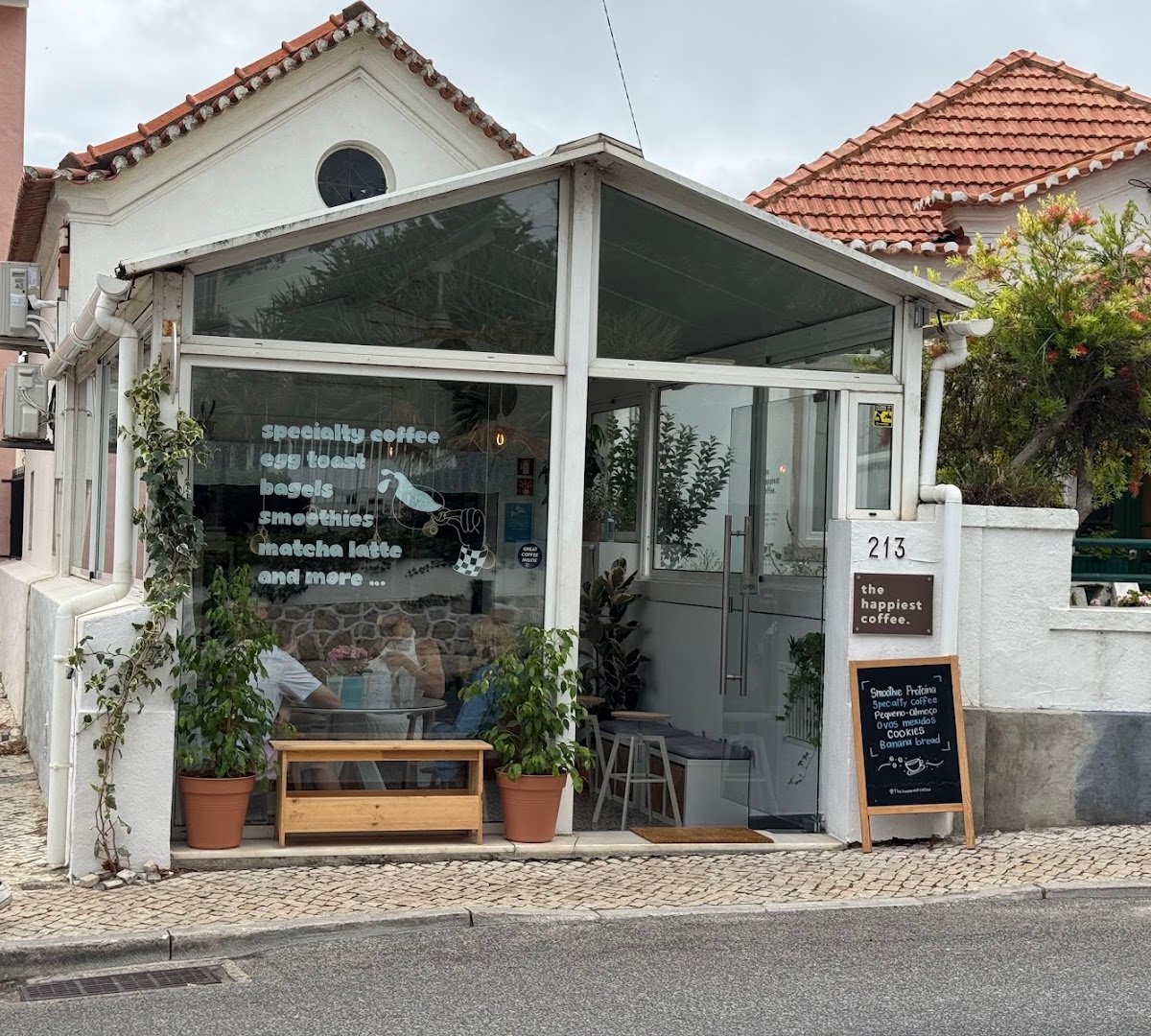 Storefront of The Happiest Coffee - Specialty Coffee - PAREDE, specialty coffee shop in Lisbon