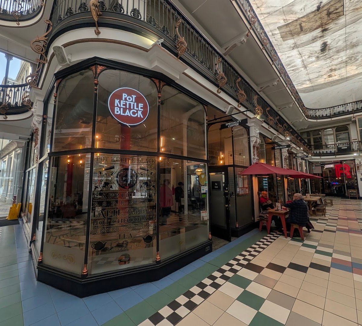 Storefront of POT KETTLE BLACK Barton Arcade, specialty coffee shop in Manchester