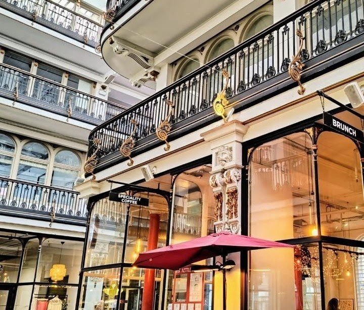 Storefront of POT KETTLE BLACK Barton Arcade, specialty coffee shop in Manchester