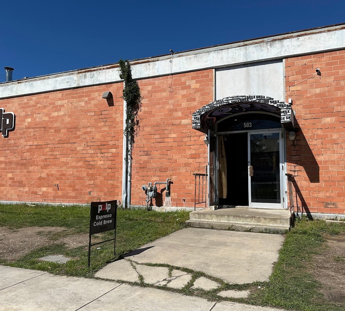 Storefront of Pulp Coffee Roasters, specialty coffee shop in San Antonio