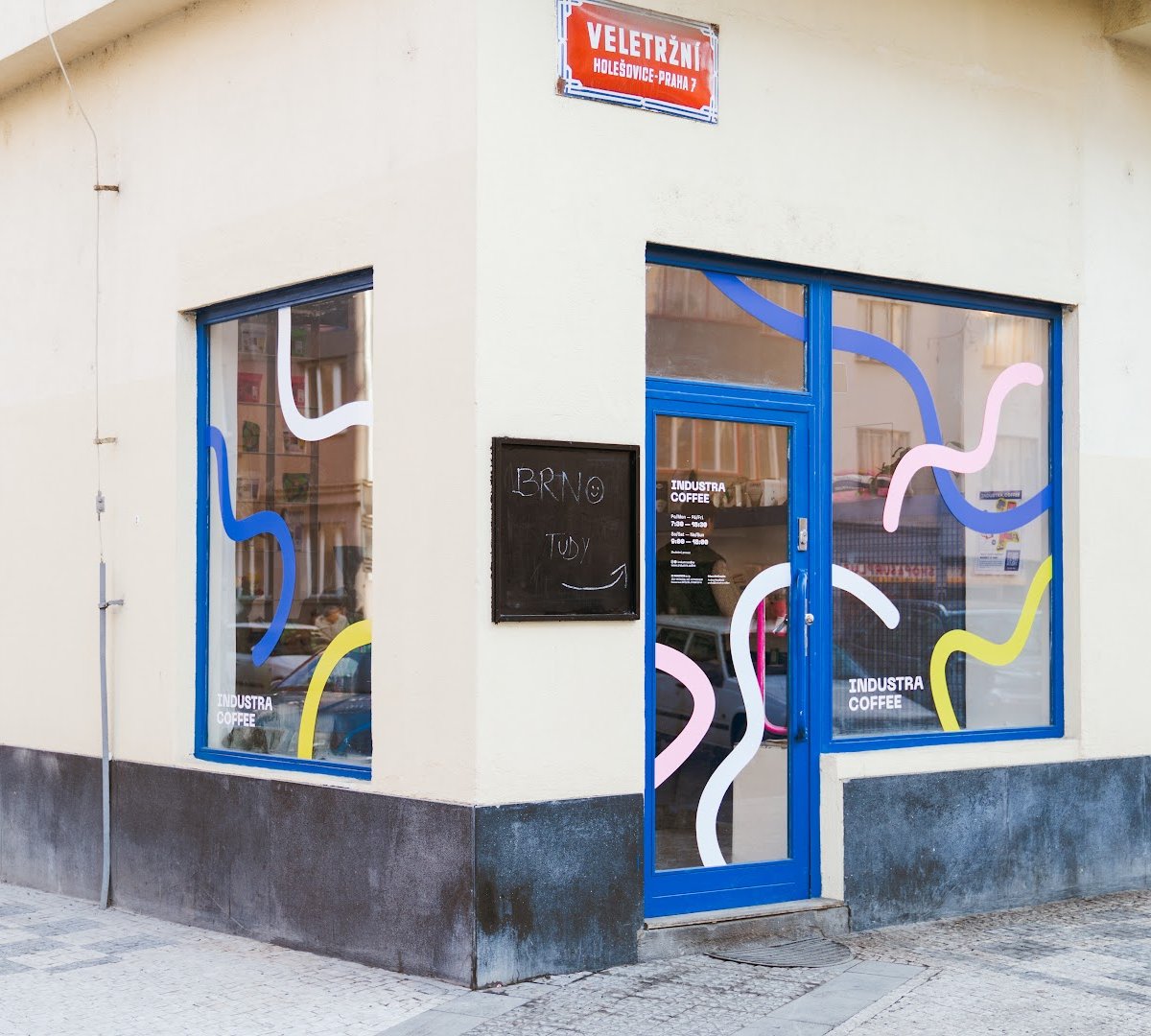 Storefront of Industra Coffee Praha Holešovice, specialty coffee shop in Prague