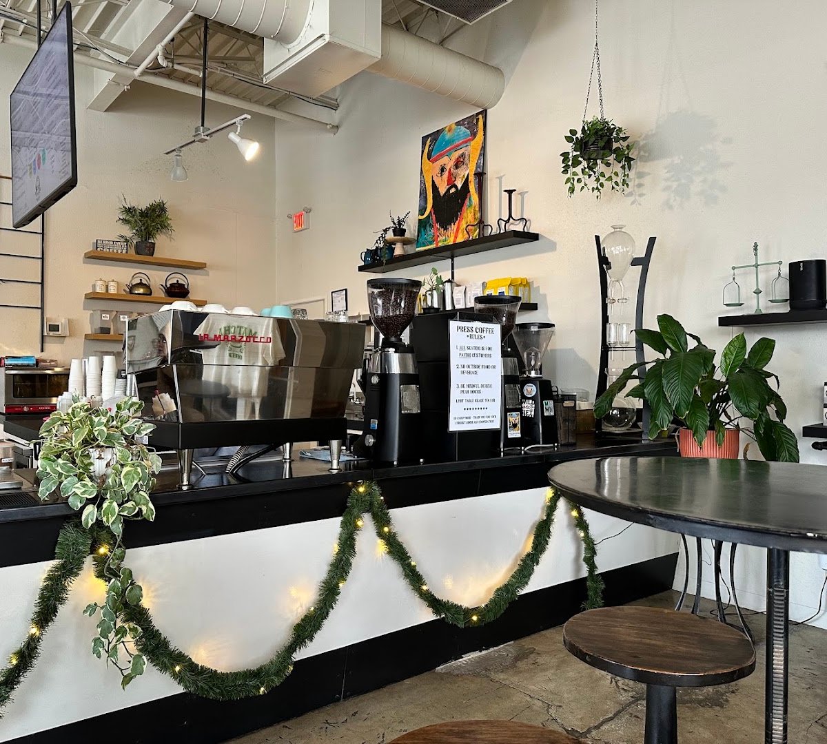 Interior of PRESS Coffee @ The Enclave, specialty coffee shop in San Antonio