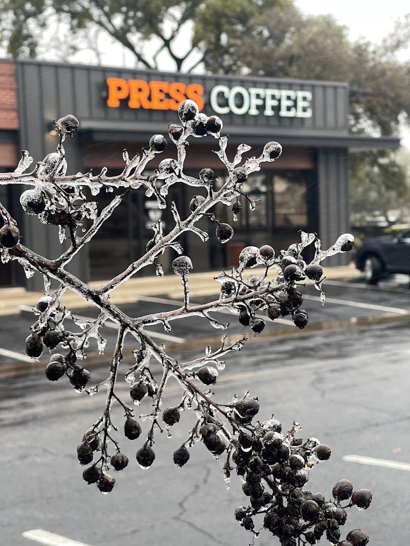 Storefront of PRESS Coffee @ The Enclave, specialty coffee shop in San Antonio