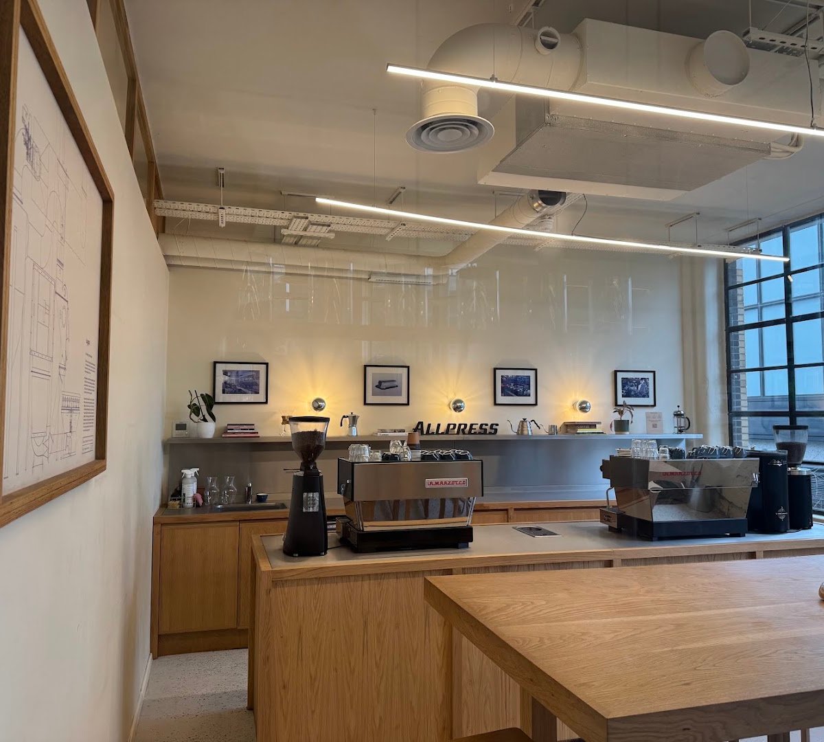 Interior of Allpress Coffee Roasters Manchester, specialty coffee shop in Manchester