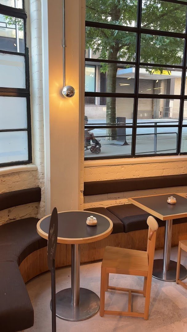 Interior of Allpress Coffee Roasters Manchester, specialty coffee shop in Manchester