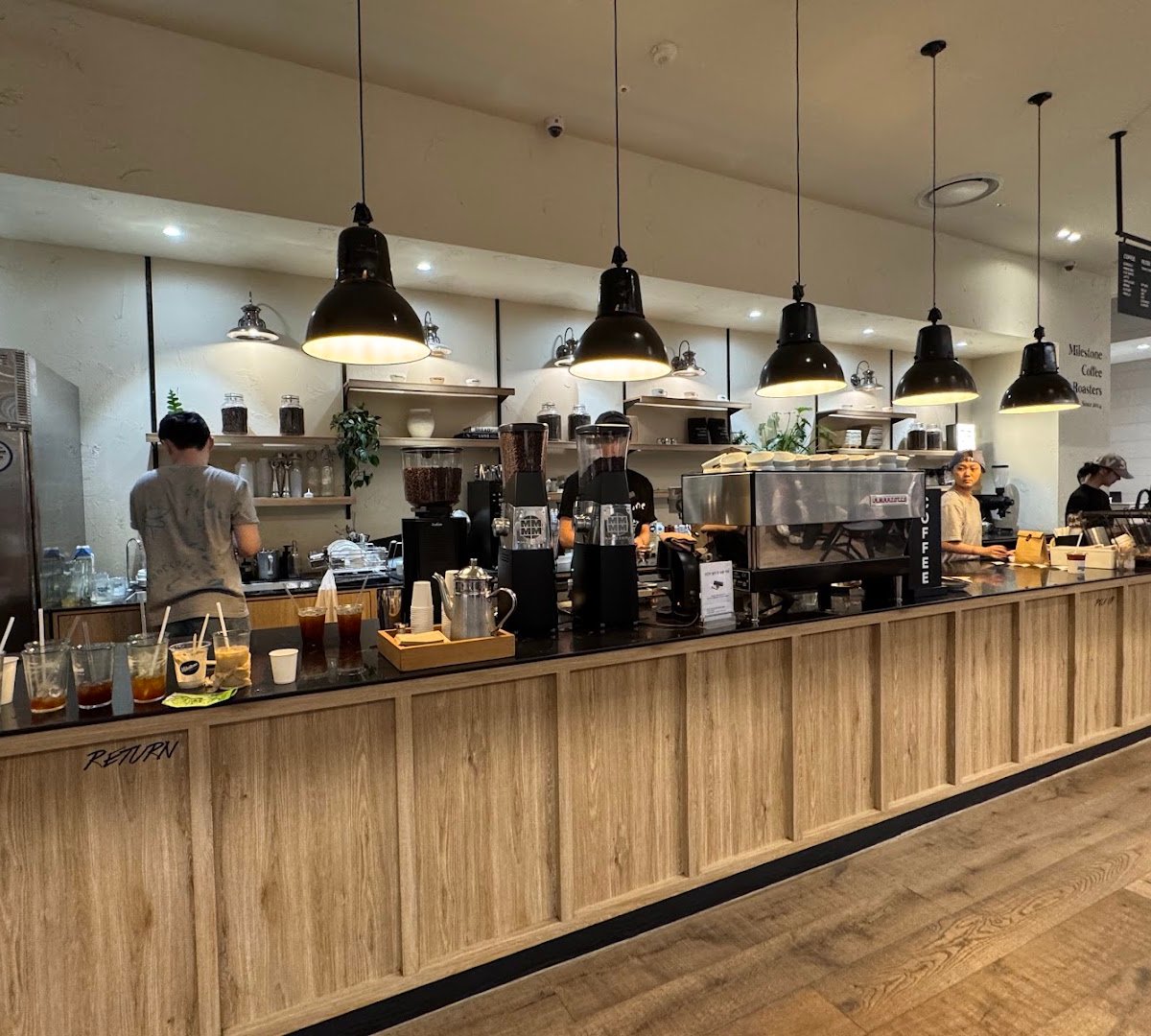 Interior of 마일스톤 커피 더현대 서울, specialty coffee shop in Seoul